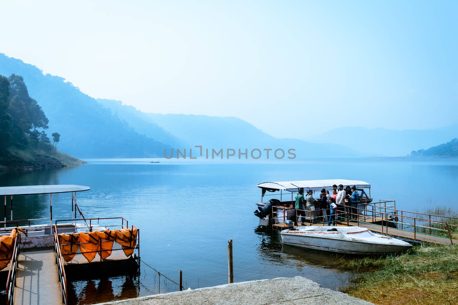 Umiam lake, shillong, Assam, India, December 15, 2017: Indian tourists people enjoying on travel holiday cruise boat tour. by sudiptabhowmick