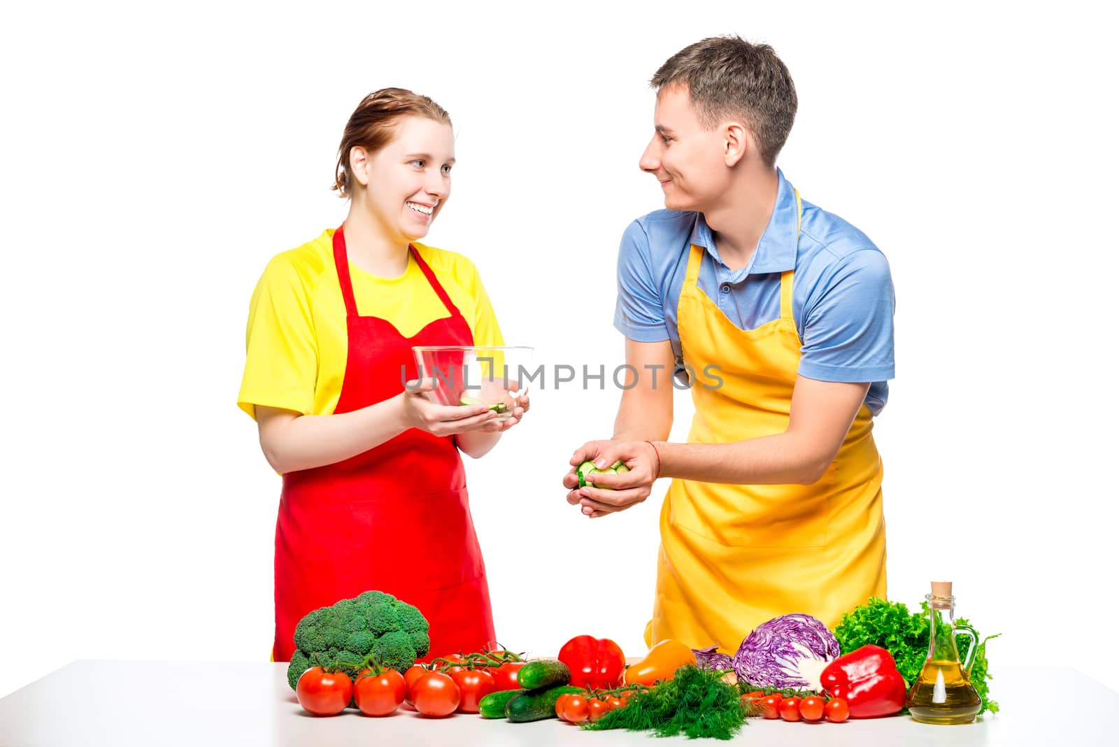 man and woman preparing healthy vegetable salad isolated on white background