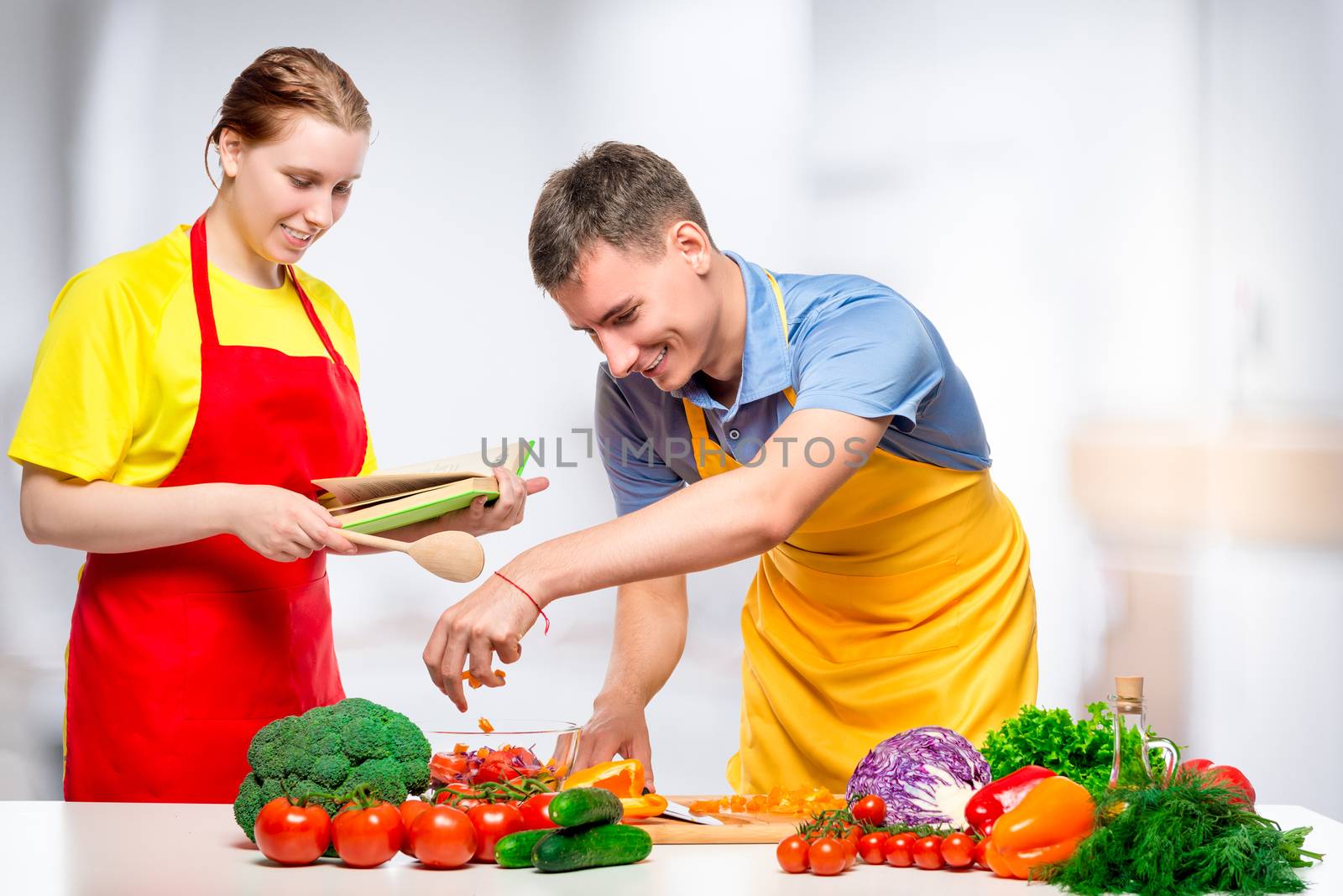 couple in love is cooking together a healthy and tasty vegetable by kosmsos111