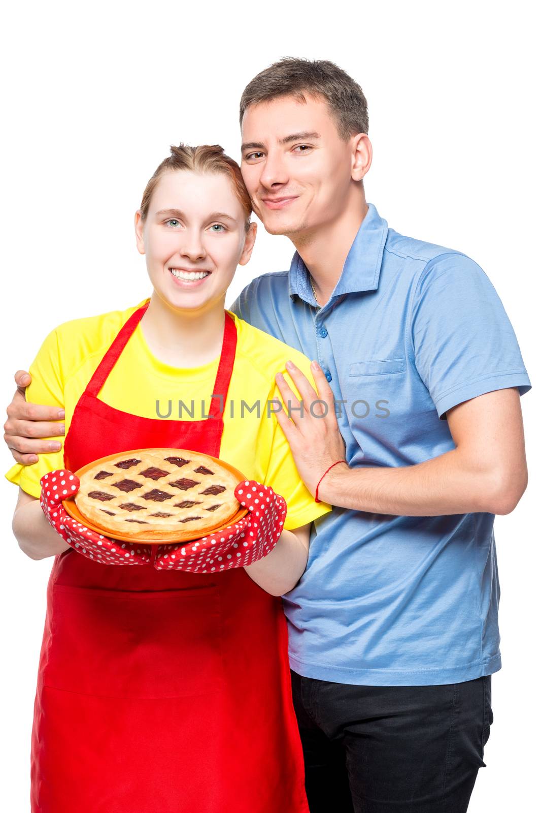 housewife in apron with pie and her beloved husband, portrait on white background