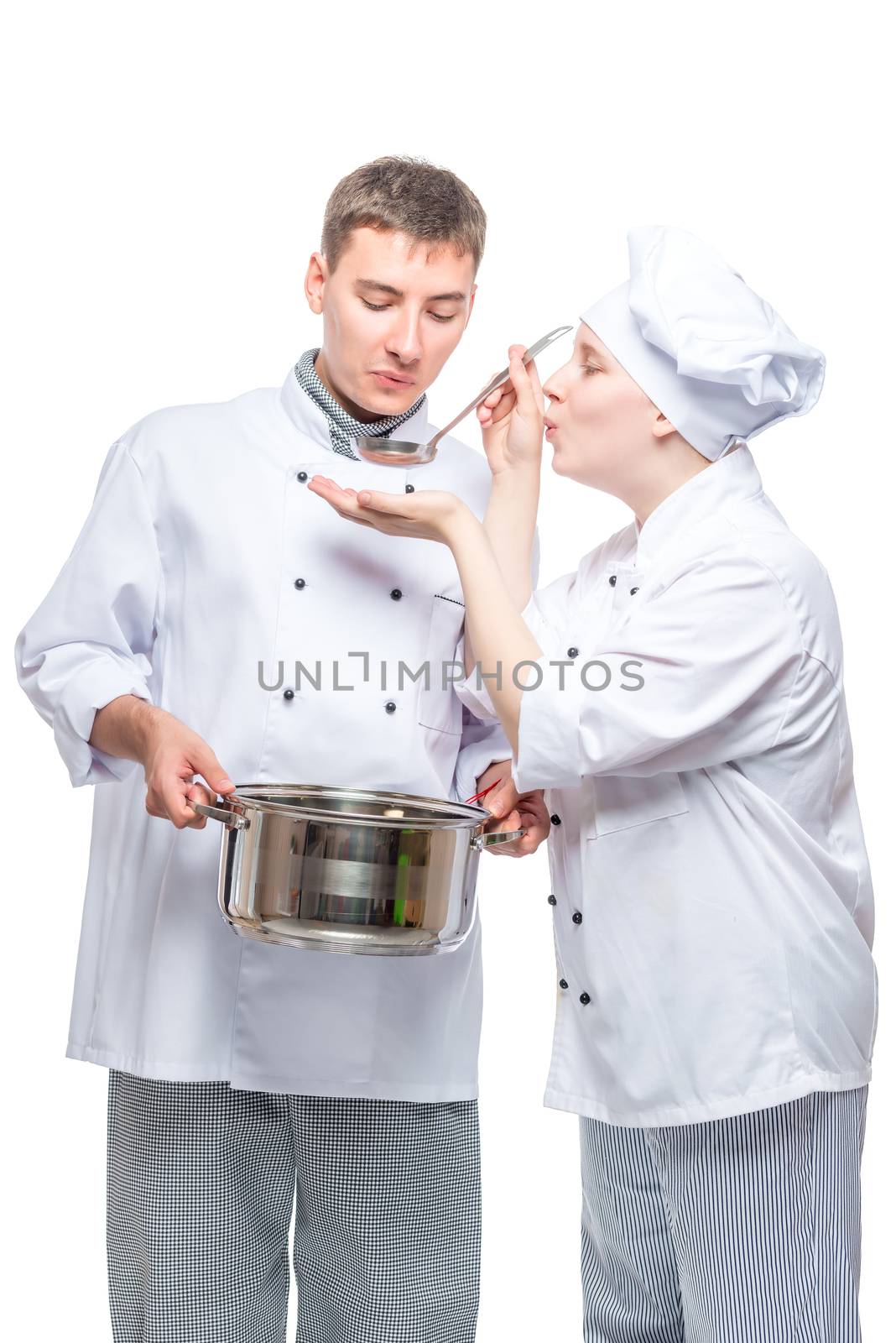 two chefs in suits try the cooked soup on a white background by kosmsos111