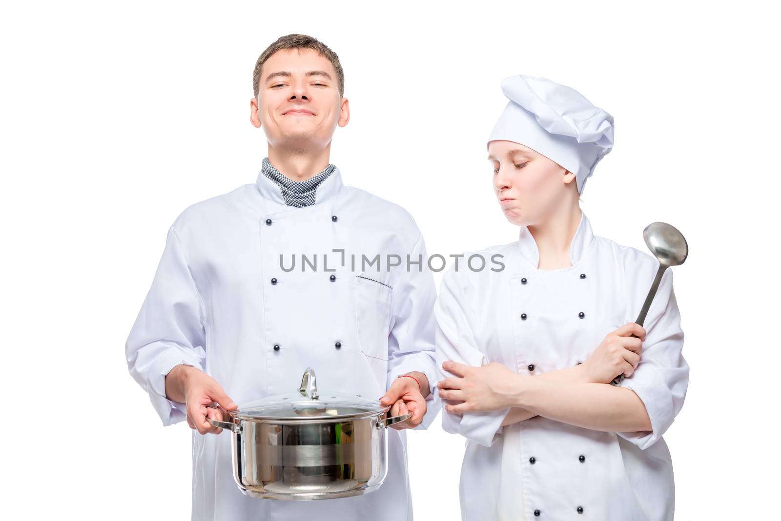 couple in cook costumes posing with a pan on a white studio back by kosmsos111