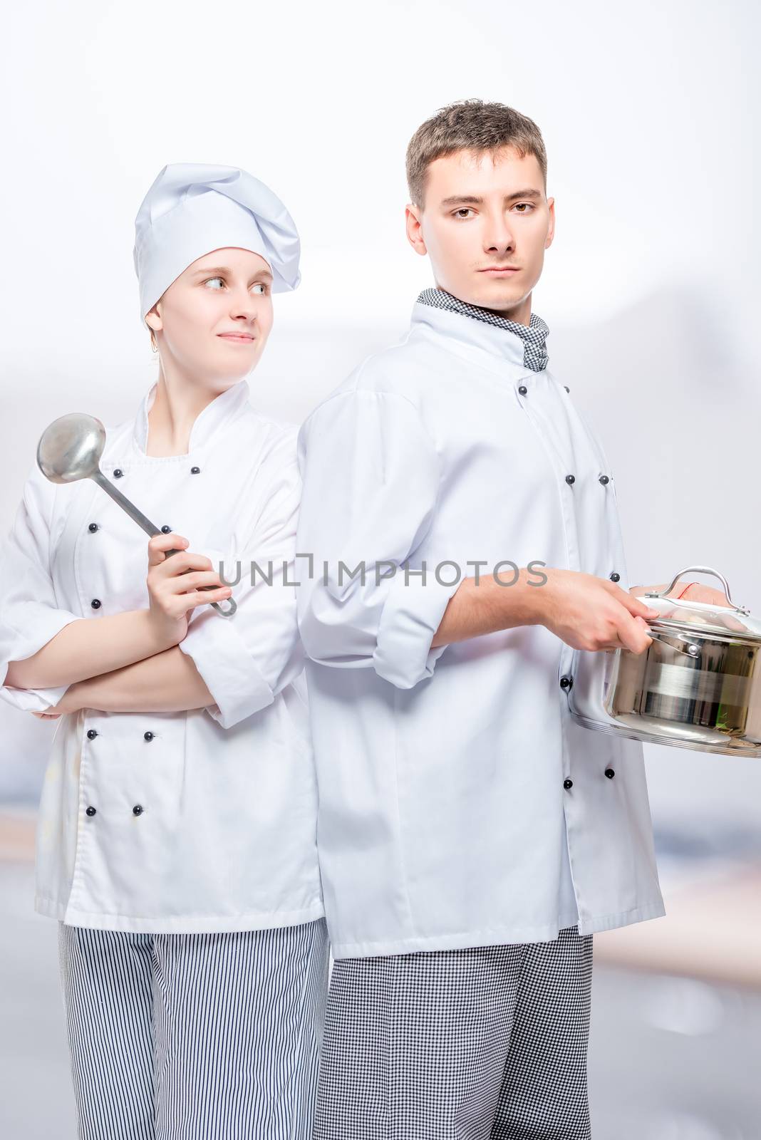 cooks in suits with a saucepan and a ladle posing against the ba by kosmsos111