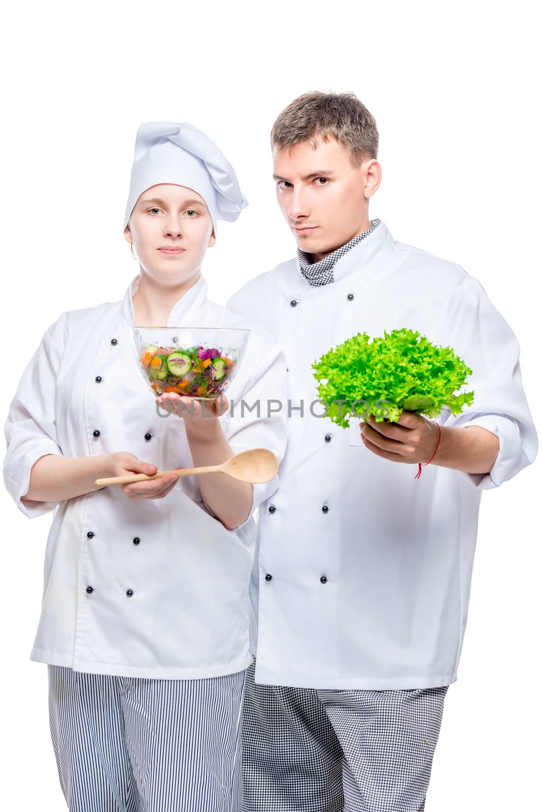 young cooks in suits with salad in hands on white background by kosmsos111