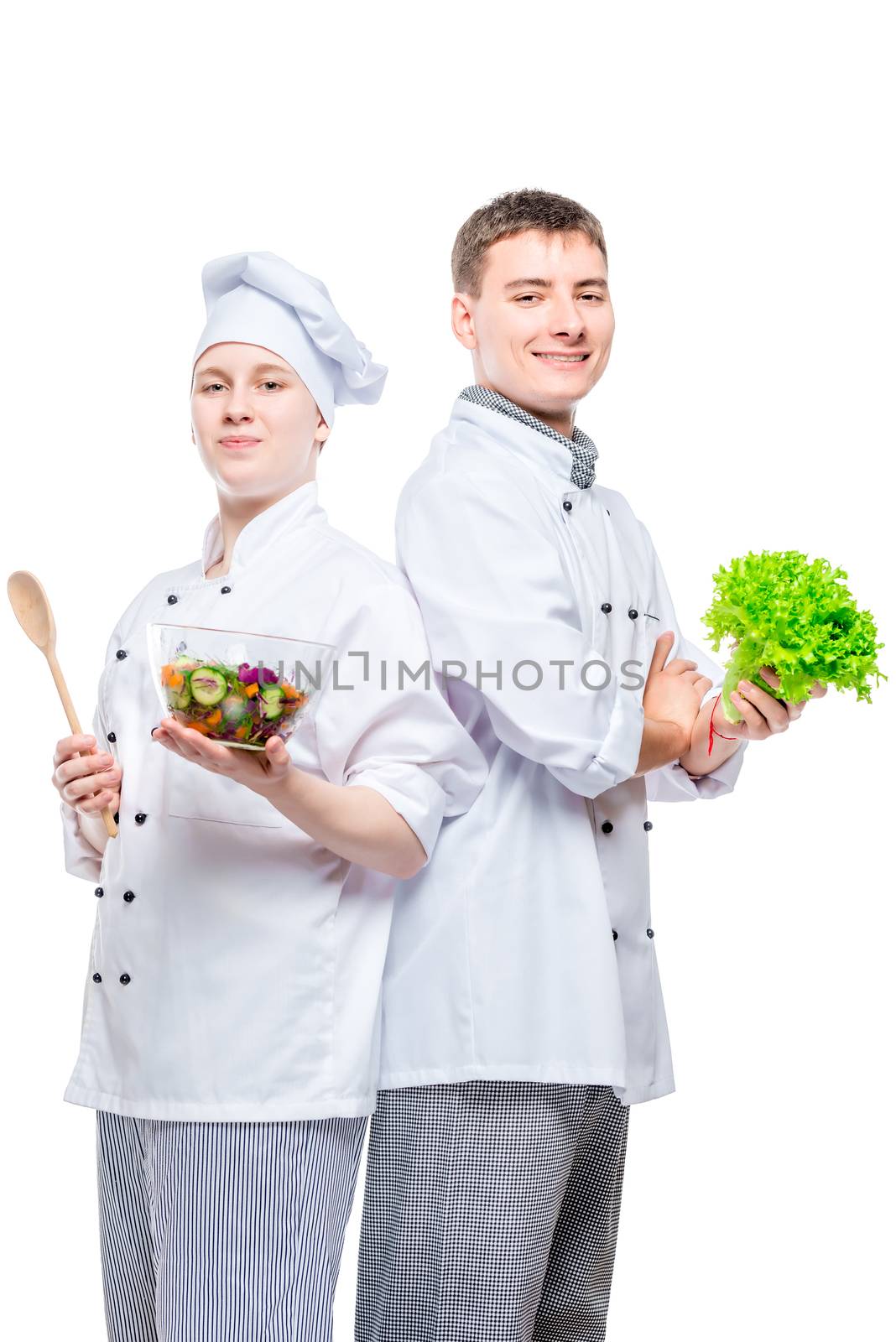 professional happy cooks in suits with salad in hands on white b by kosmsos111