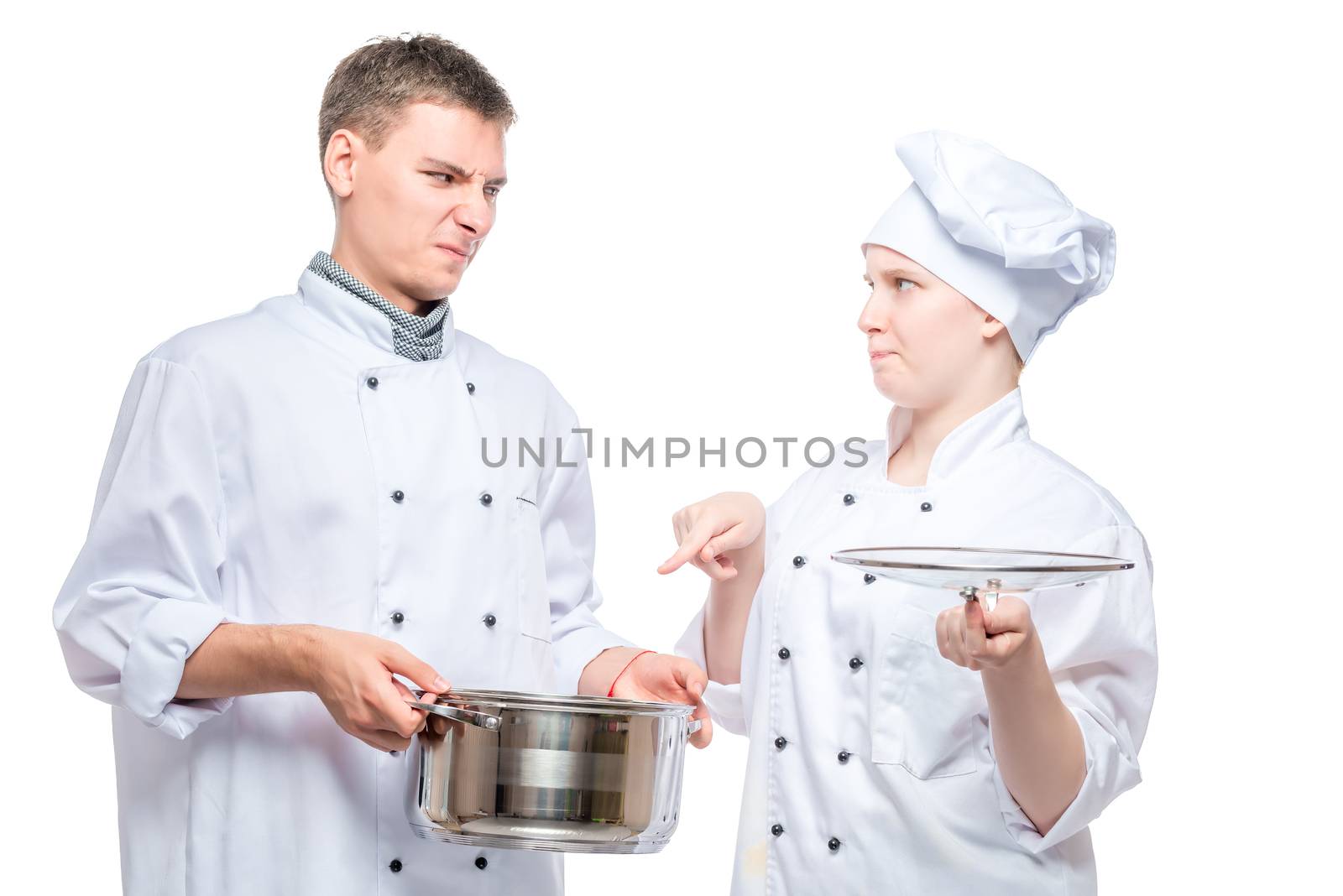 chef looks at a cooked dish of a young cook with a reproach on a by kosmsos111