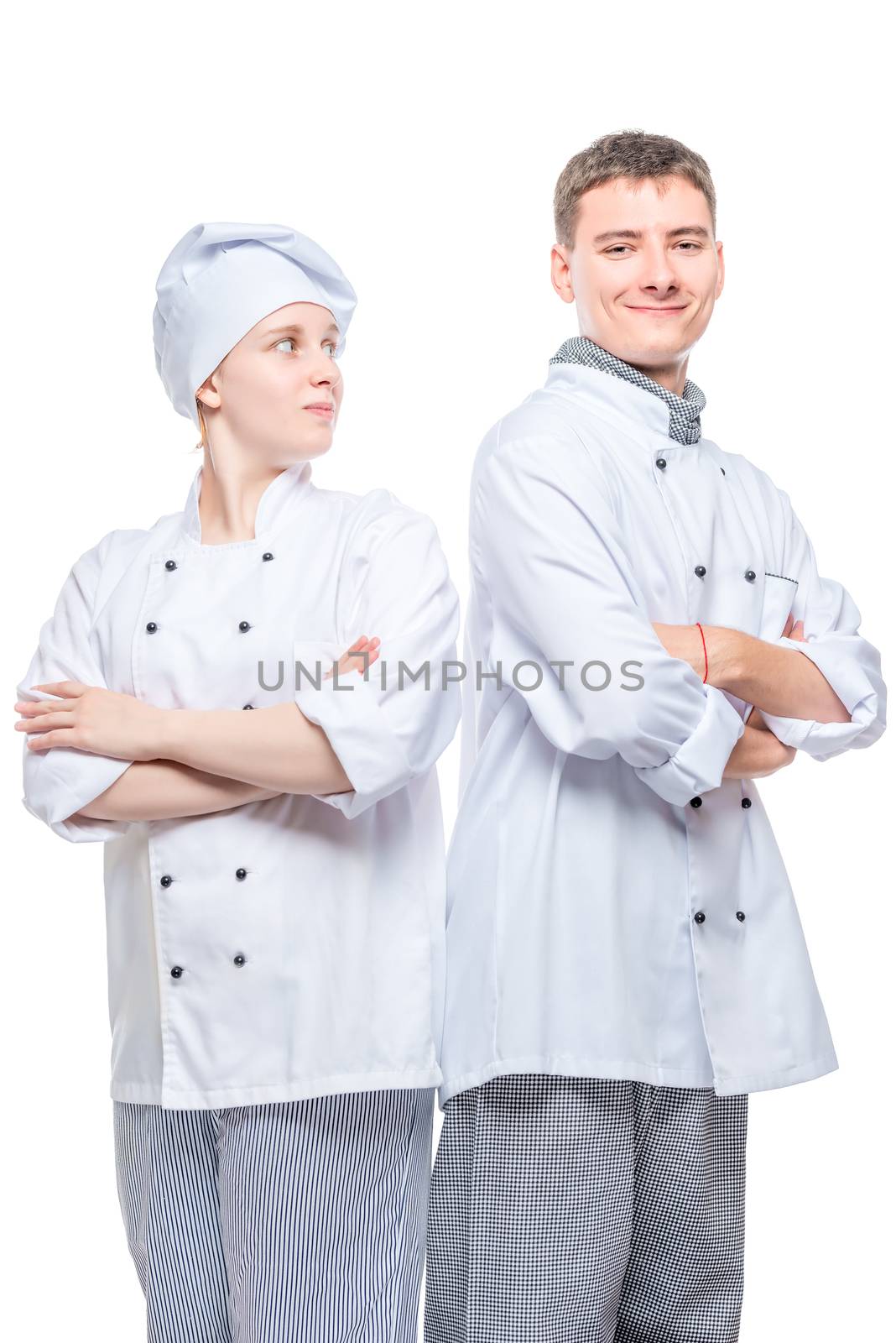 vertical portrait of a successful team of professional chefs in suits on a white background