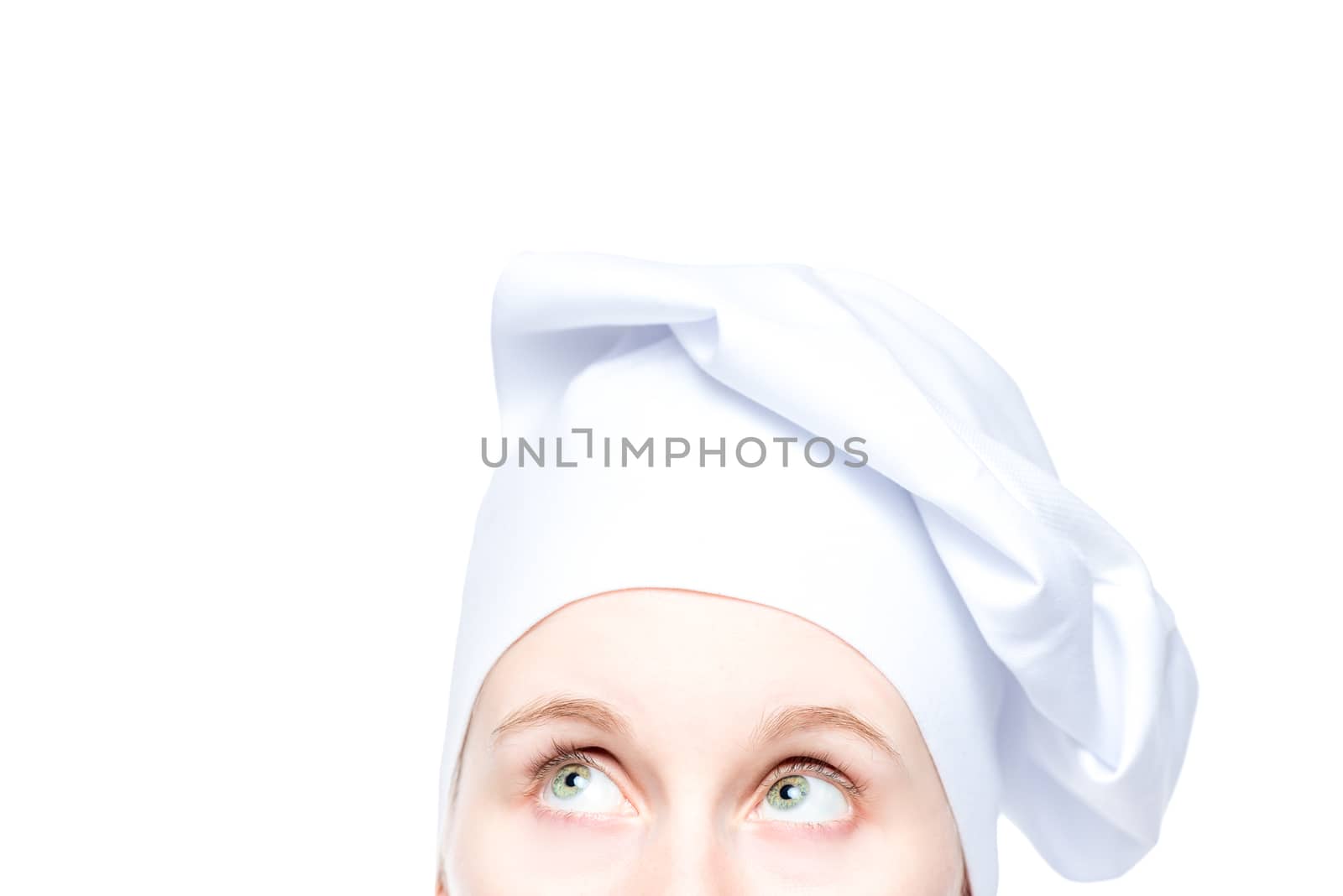 eyes of cook in hat close up on white background