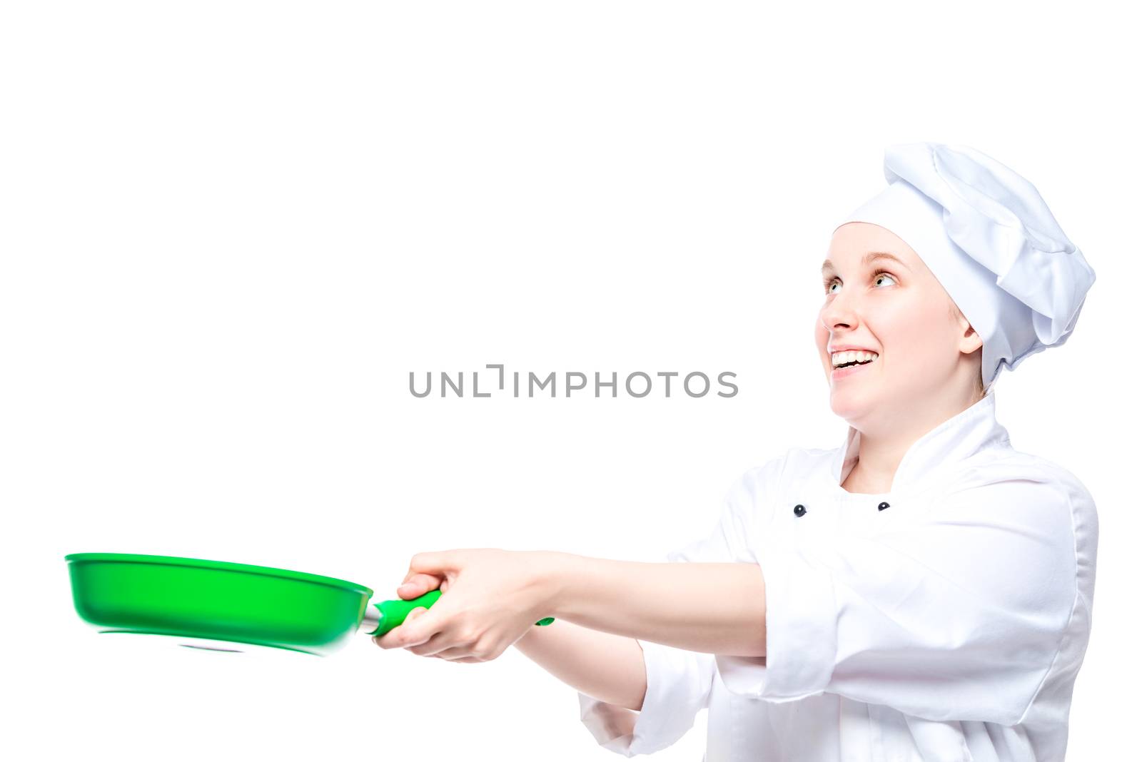 experienced chef throws up food in a pan, emotional portrait on a white background in the studio