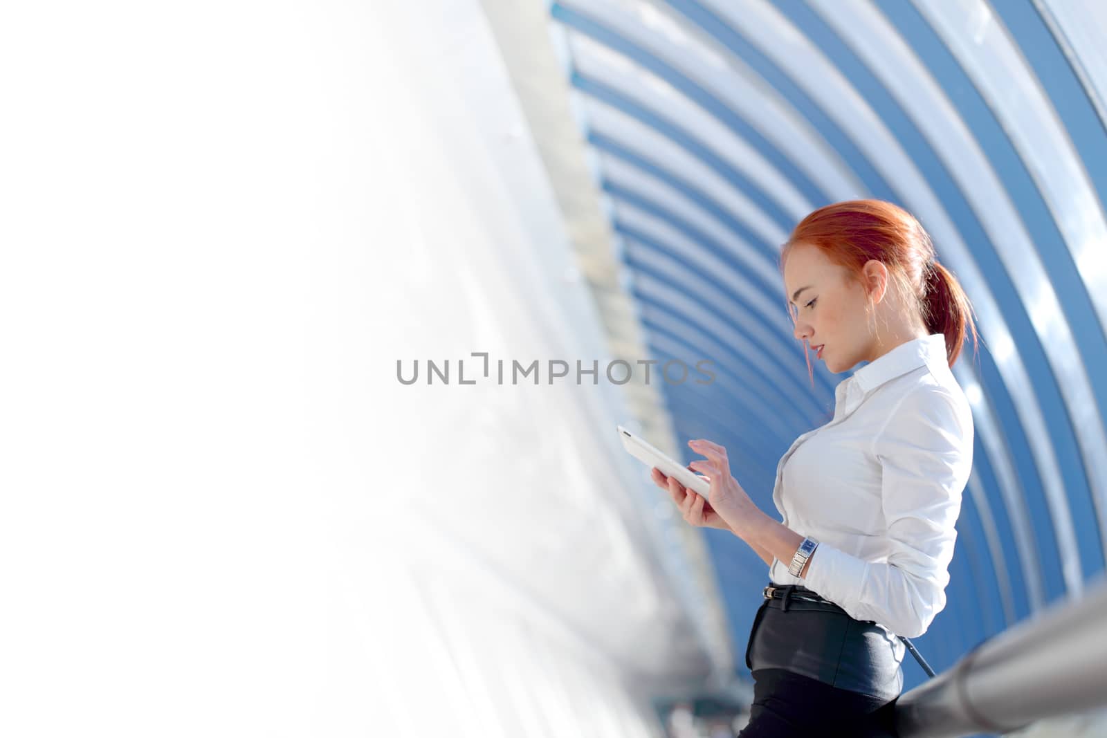 Businesswoman using tablet by ALotOfPeople