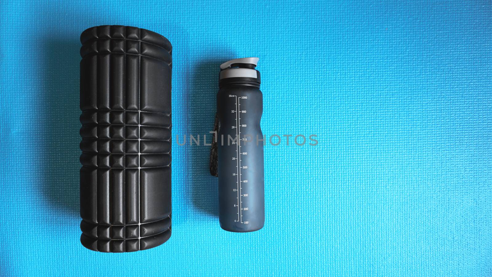 Foam Roller Gym Fitness Equipment Blue background self Myofascial Release by natali_brill