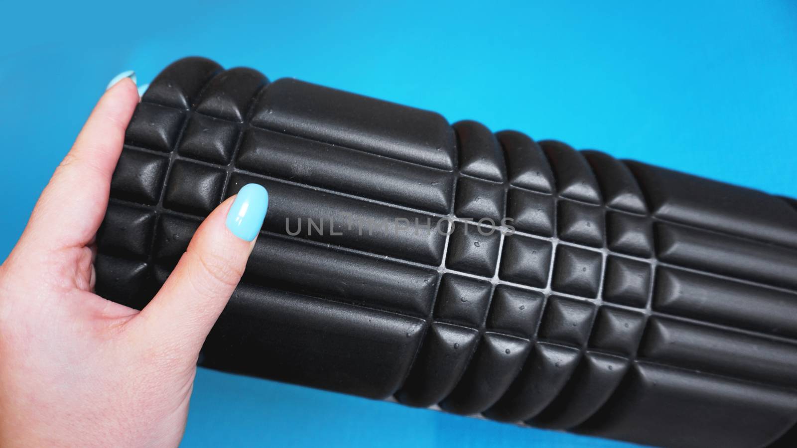 Foam Roller Gym Fitness Equipment Blue background self Myofascial Release by natali_brill