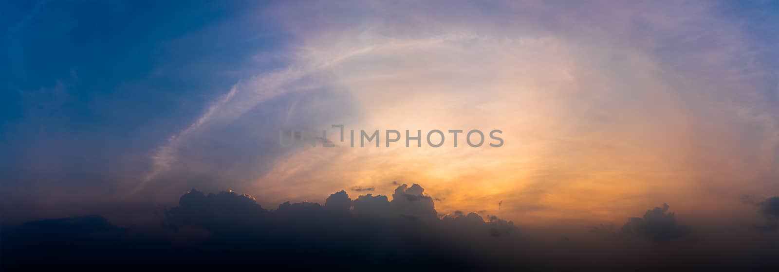 Panoramic sunset with fluffy cloud in the twilight  by stoonn