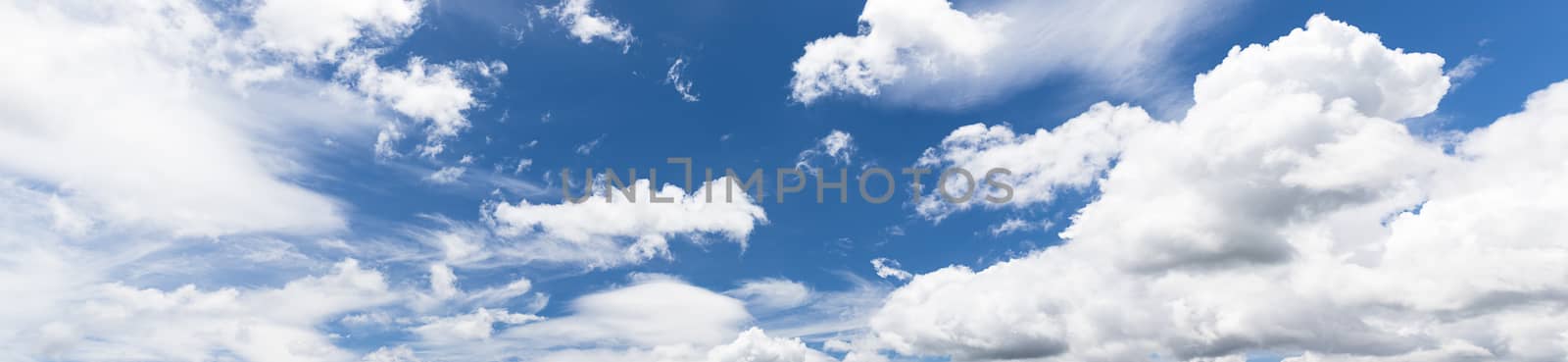 Panoramic white fluffy clouds in the blue sky, Fantastic soft white clouds against blue sky