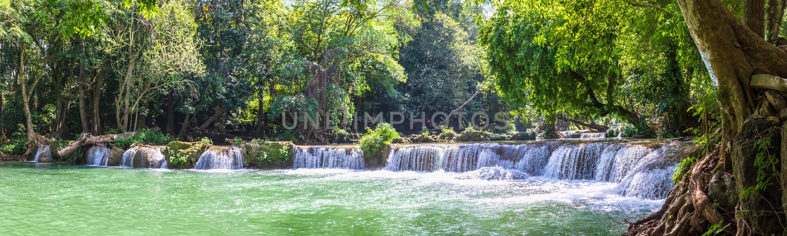 Waterfall in a forest on the mountain in tropical forest by stoonn