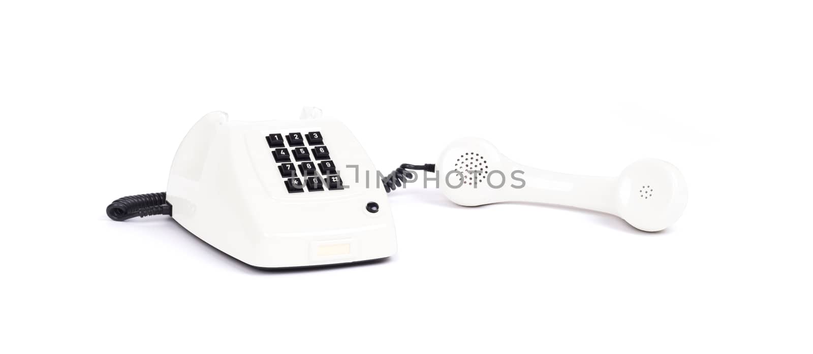 Vintage white telephone with a white background