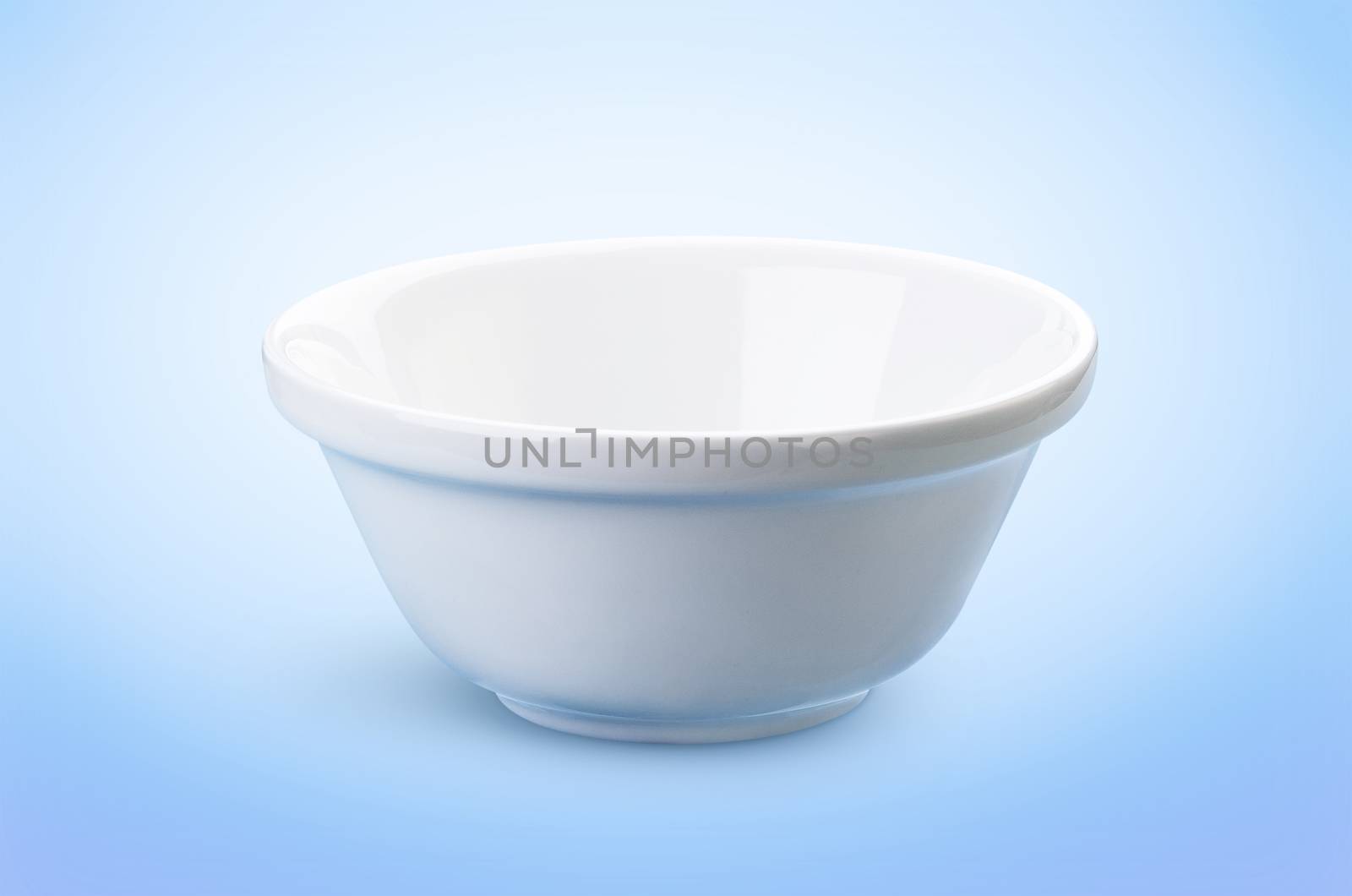 Empty white bowl isolated on blue background, ideal for the presentation of dairy products by xamtiw