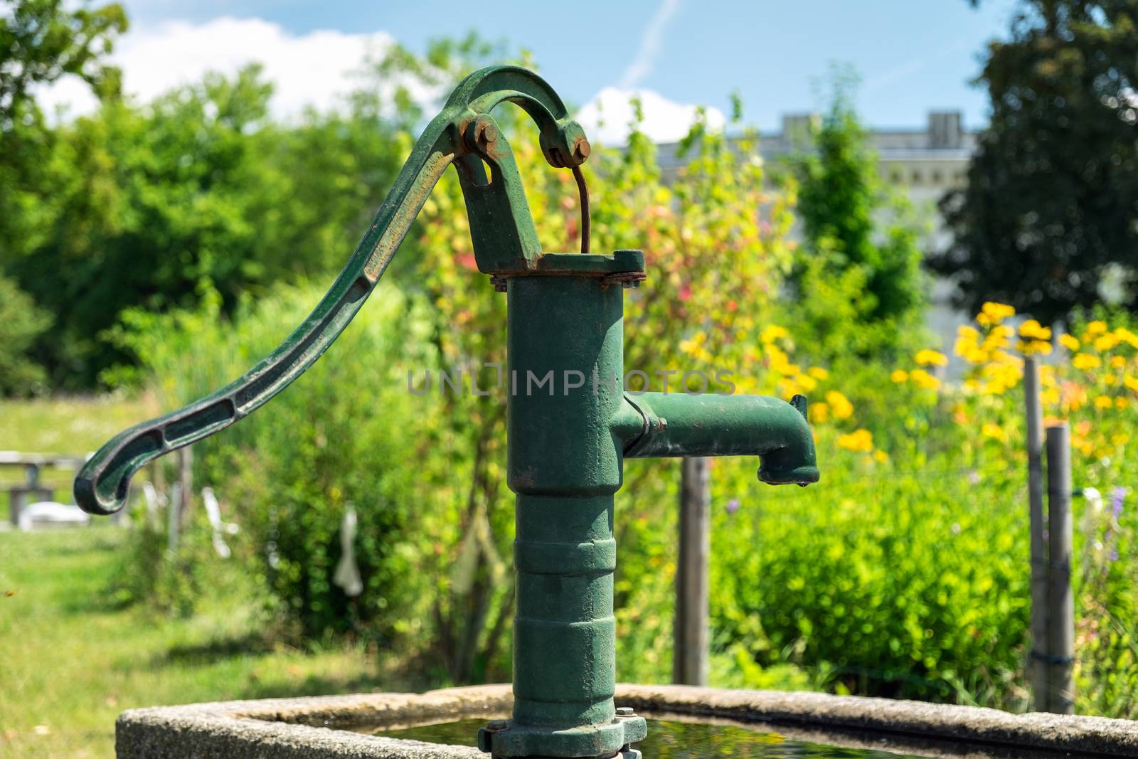 Manual water pump at Klenze Park in Ingolstadt, Germany in the summer