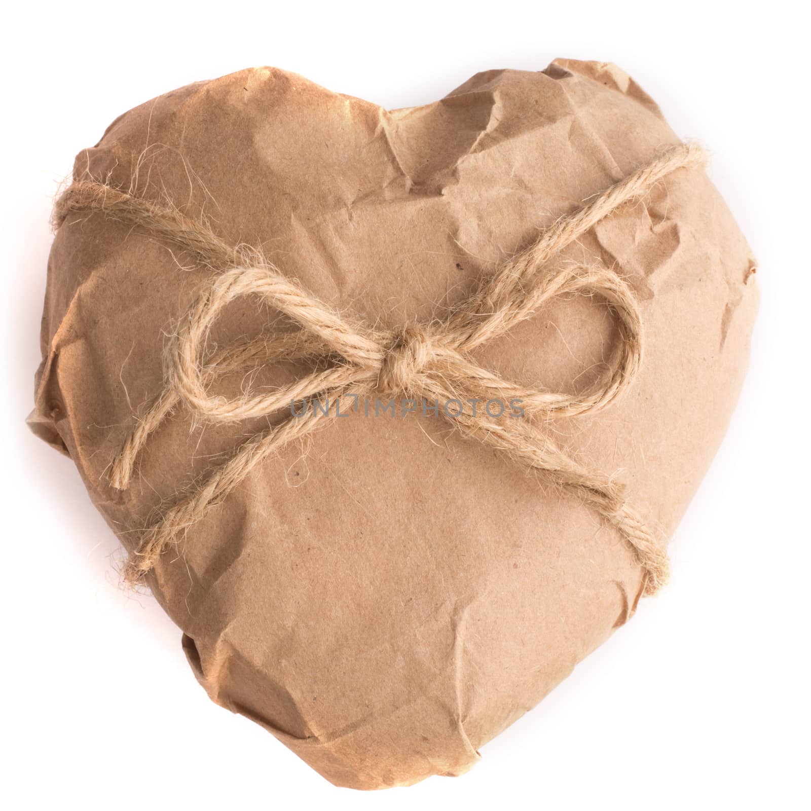 Heart in brown Wrapping Paper tied with rope bow isolated on white background Valentine day surprise concept