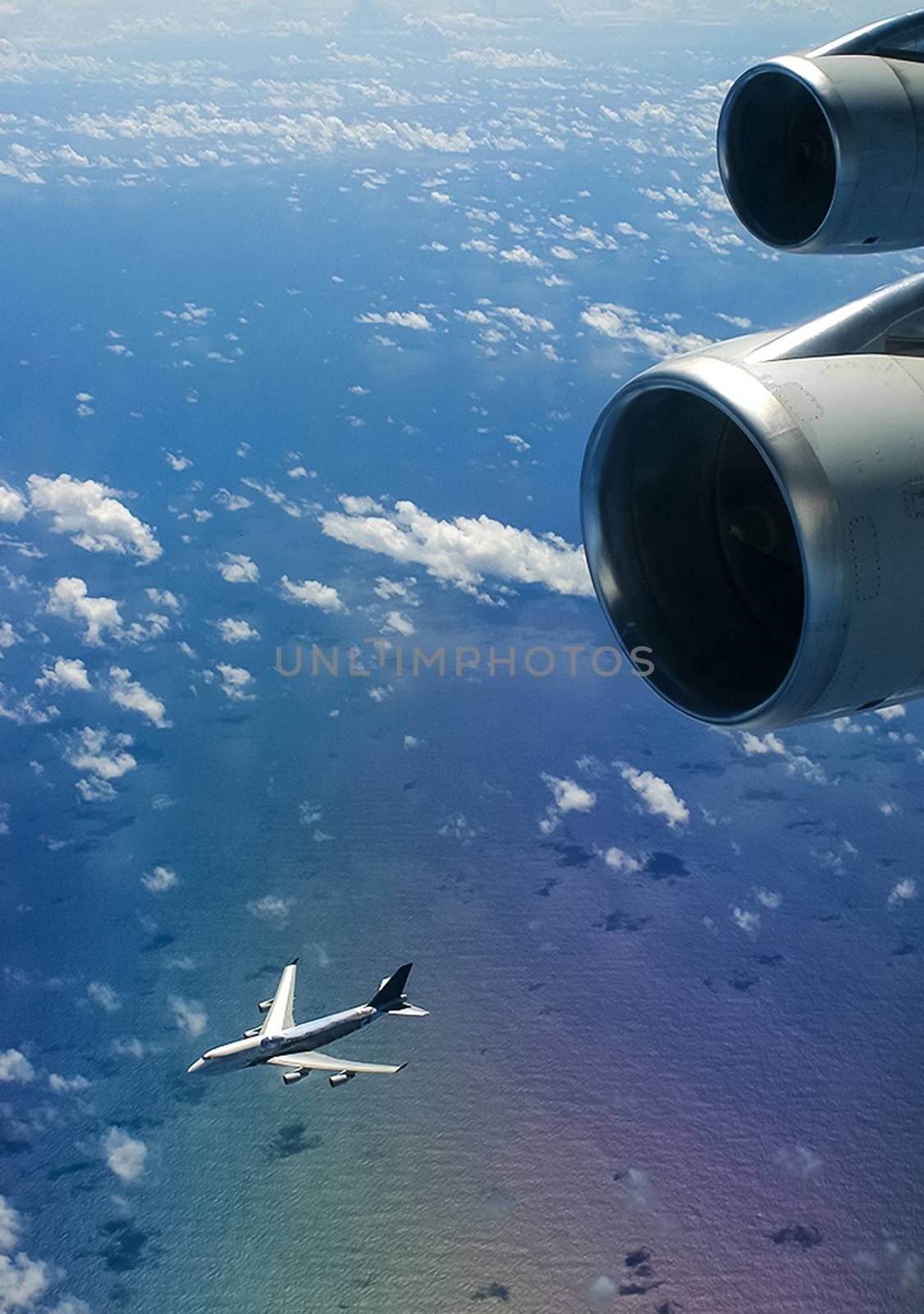 The view from the window of a passenger plane during the flight, the wing of the turbine engine of the aircraft.