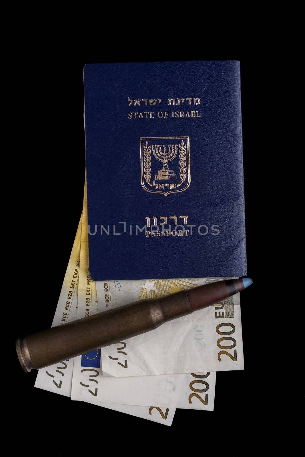 Israelian passport with 200 euro banknotes and a big rifle bullet isolated on black