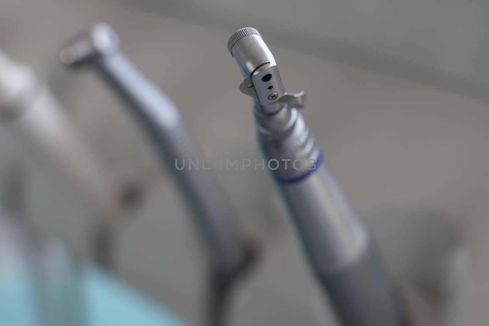 Dentist chair tools closeup on the hand piece drill