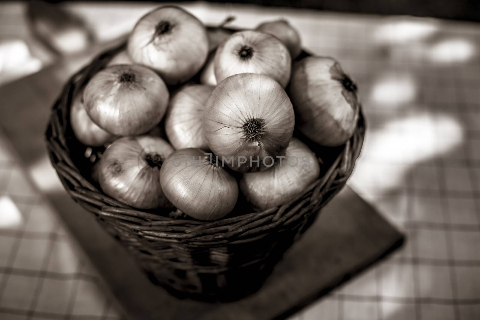 Onion in a basket old stylich photot