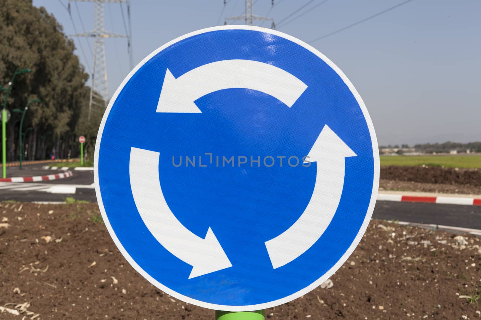 Roundabout blue traffic sign with background