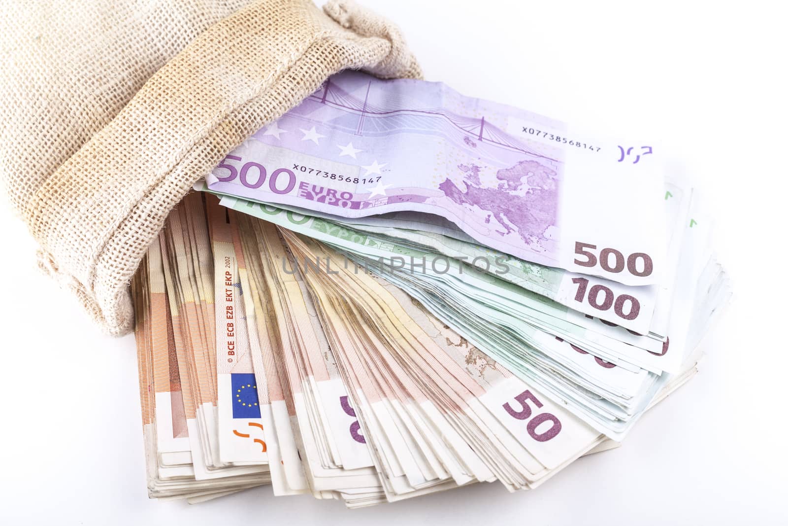 A bag full with euro banknotes isolated on white background
