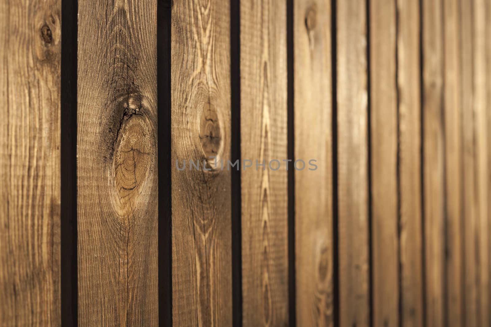 Old wood brown fence  closeup with interesting texture