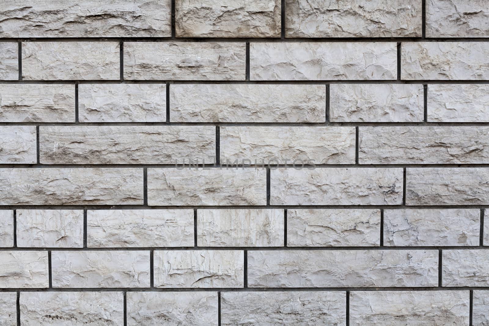 Aged brown Rectangular stone wall texture closeup