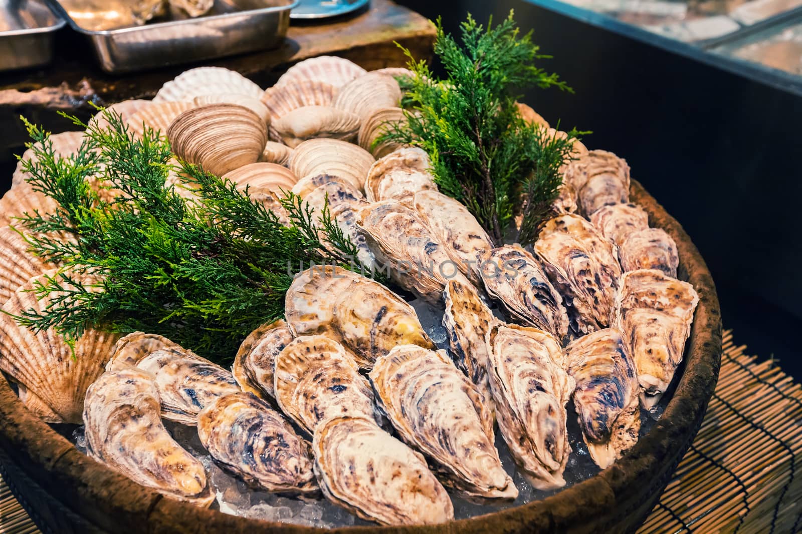 Fresh oyster on ice as street food at Nishiki market in Kyoto, Japan
