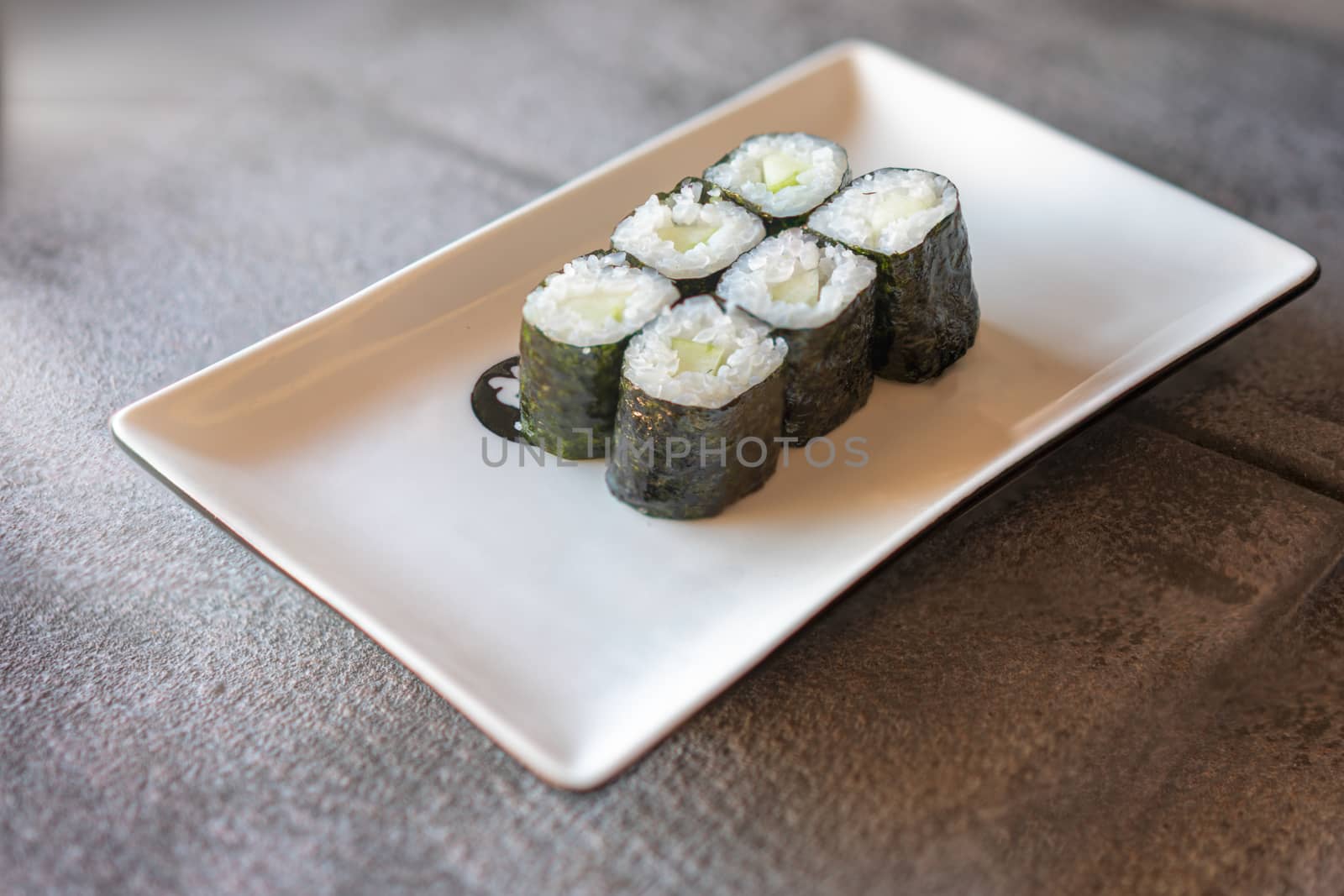 Cucumber Sushi served  on plate by Robertobinetti70