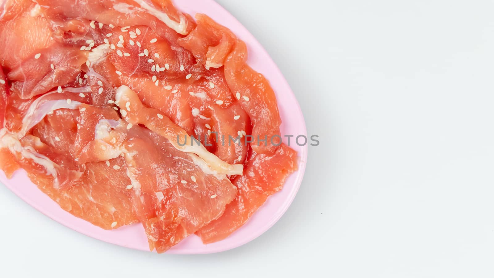 top view raw pork on plate  over white background