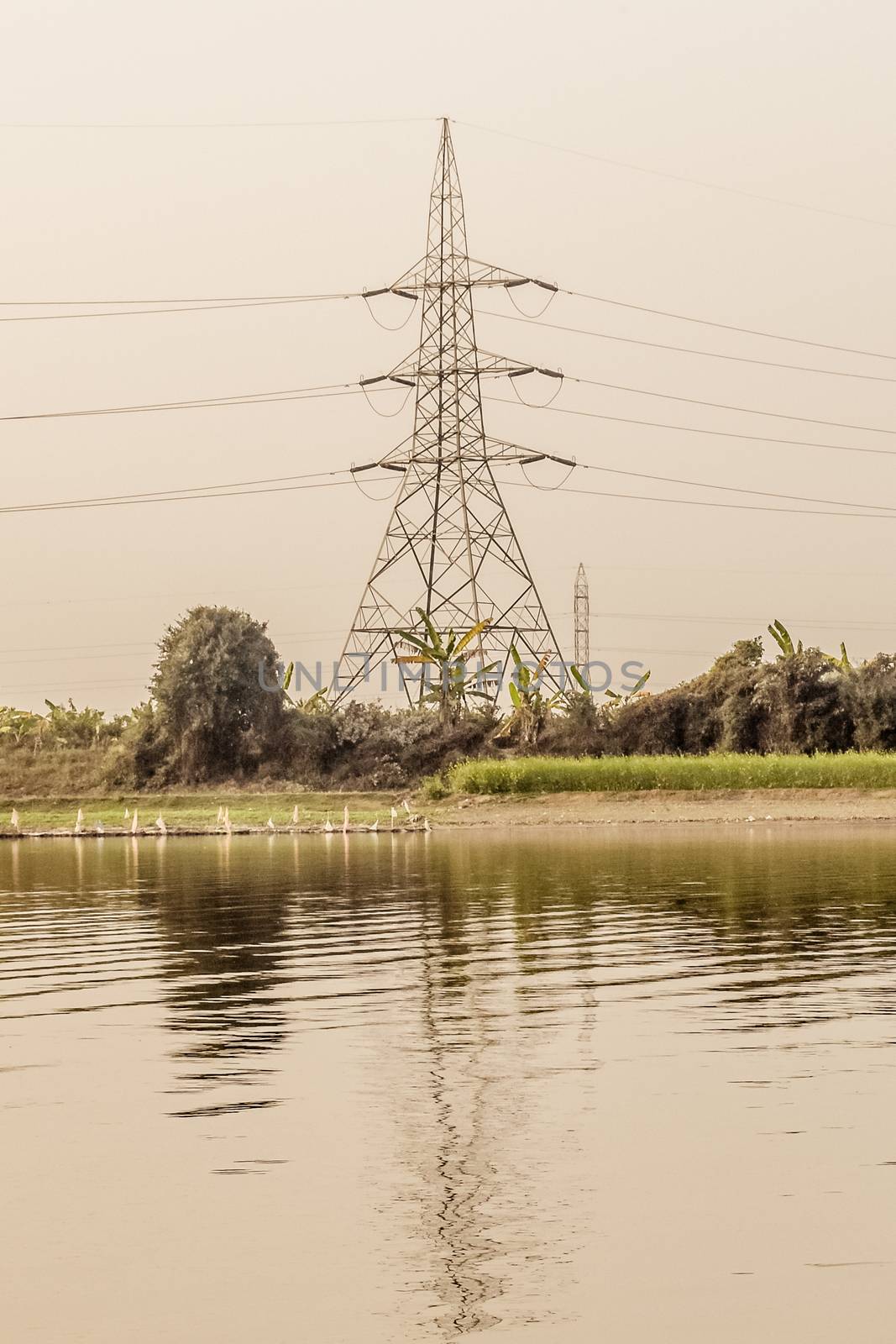 A transmission tower or power tower (electricity pylon or electric pylon in the United Kingdom, Canada and parts of Europe) tall structure, a steel lattice tower, used to support overhead power line. by sudiptabhowmick