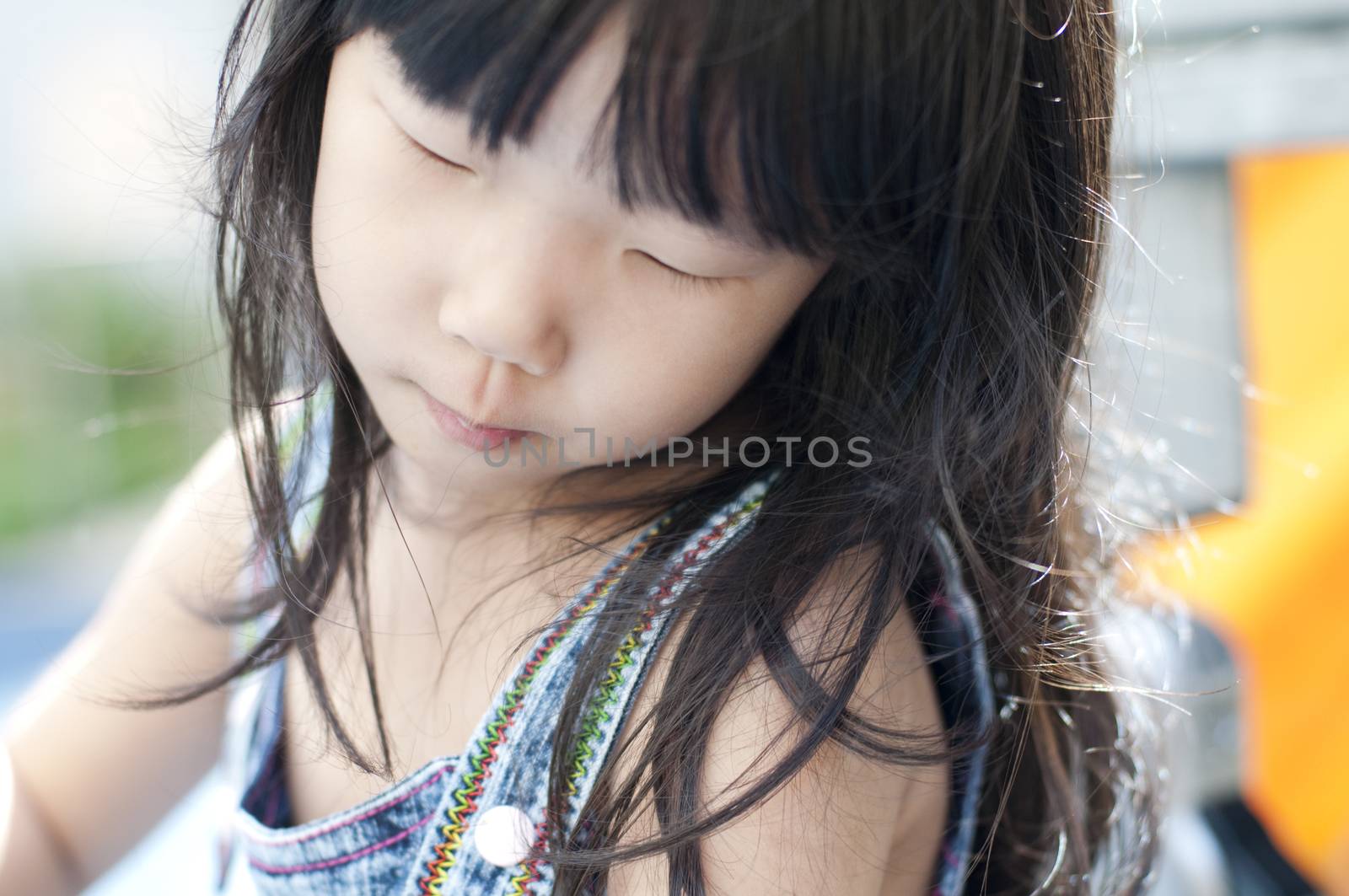 Asian girl having fun in playground.  by szefei