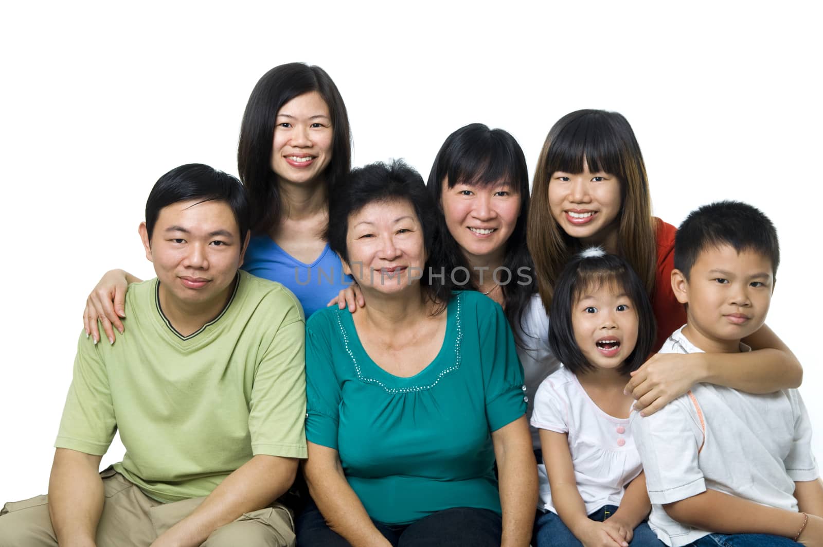 Larger Asian family portrait on white background, three generations.