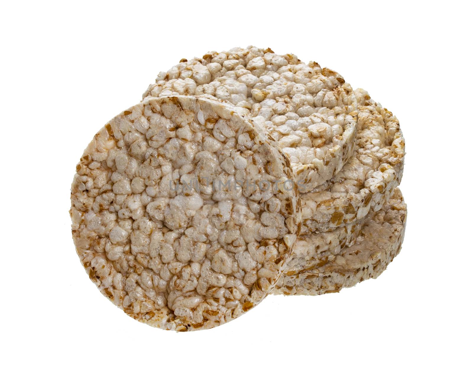 Puffed rice bread sta?k isolated on white background, crushed diet crispy round rice waffles