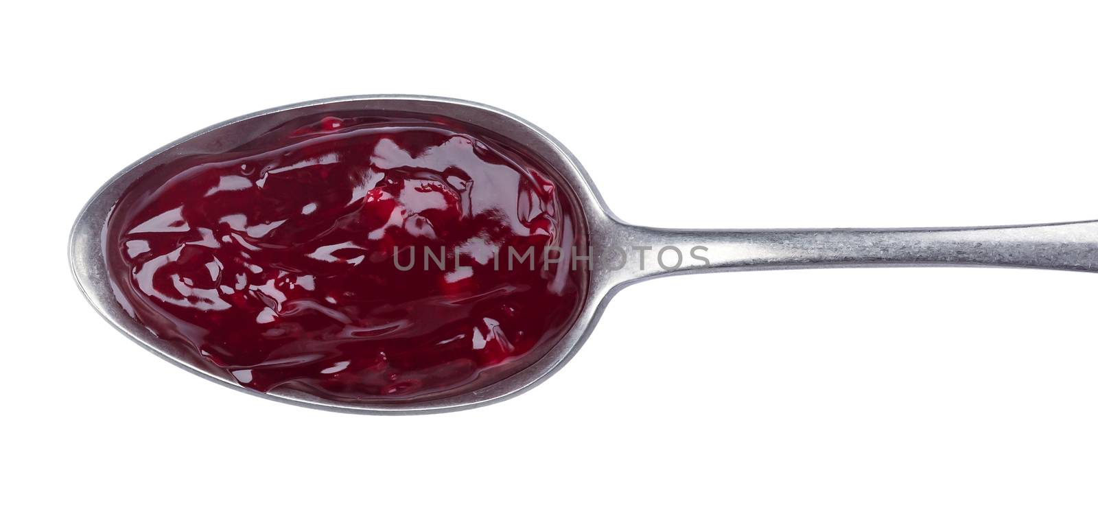 Spoon of red berry jam isolated on white background, sweet cherry jam, top view