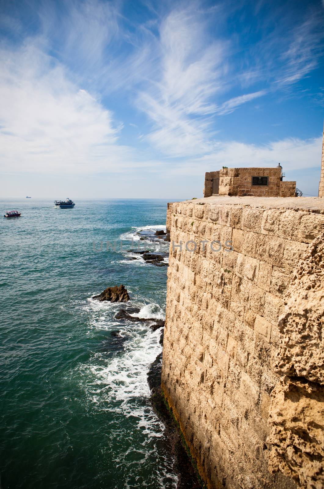 Old City of Acre surrounding wall with the mediterranean sea at the bottom