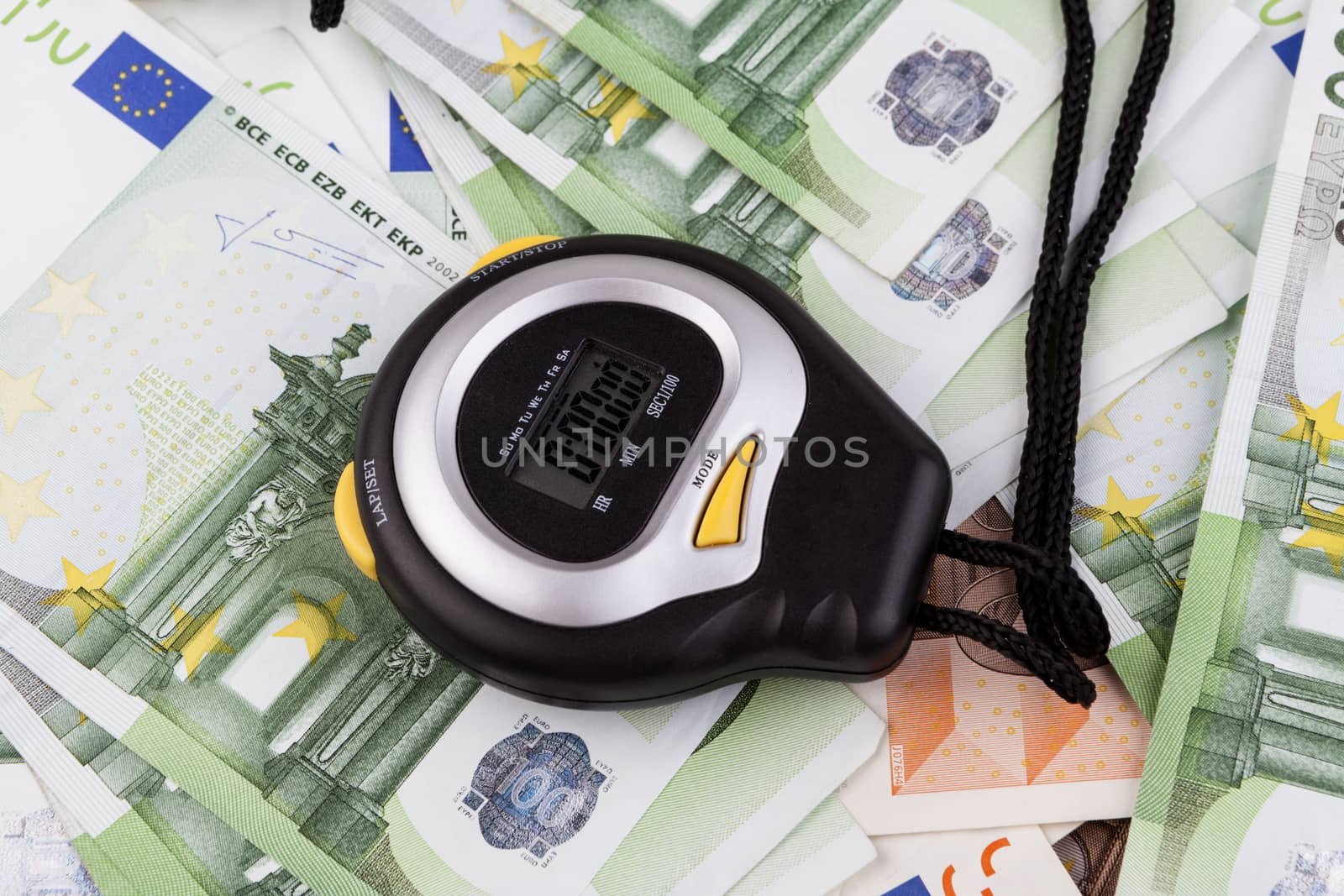 Black Digital stopwatch on various euro banknotes