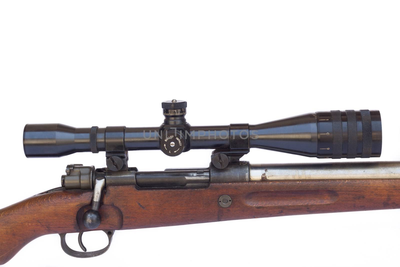 Black scope close-up on old sniper rifle isolated on white