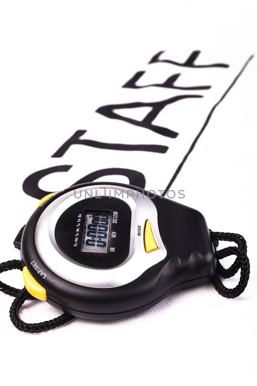 Black digital stopwatch on white background with staff writing