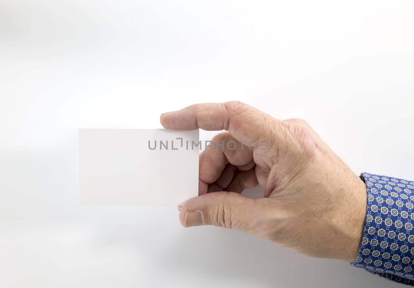 Hand holding blank plain white business card design isolated on white background