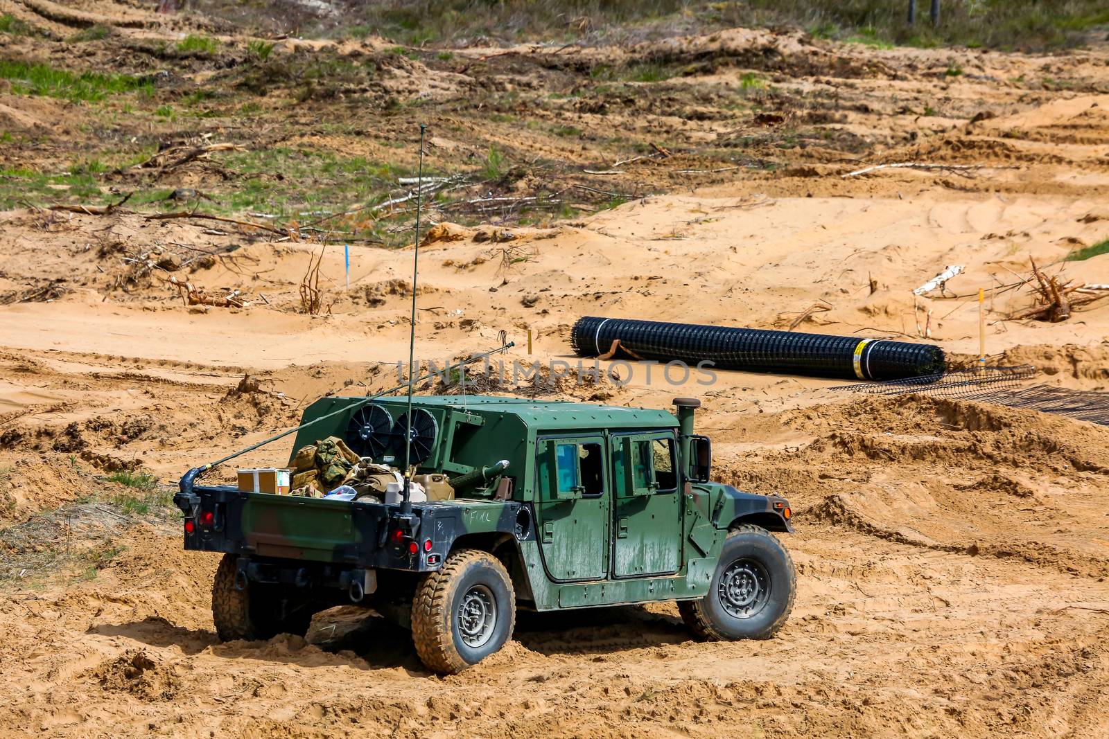 NATO Hummer military vehicles. Soldier on armored Hummer. International Military Training "Saber Strike 2017", Adazi, Latvia, from 3 to 15 June 2017. US Army Europe-led annual International military exercise Saber Strike Field Training Exercise in Latvia.