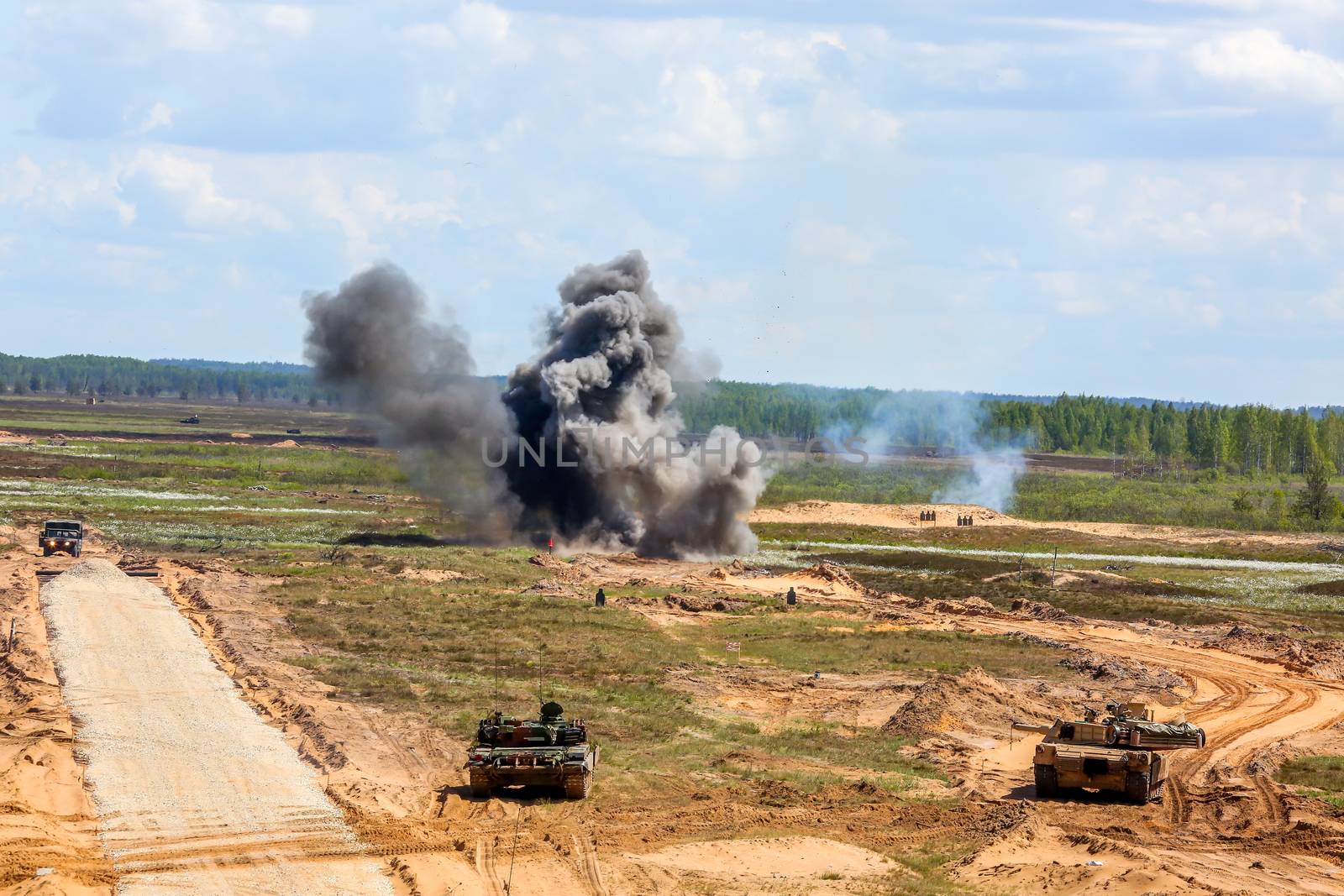 Explosion, smoke and military vehicles. International Military Training "Saber Strike 2017", Adazi, Latvia, from 3 to 15 June 2017. US Army Europe-led annual International military exercise Saber Strike Field Training Exercise in Latvia.