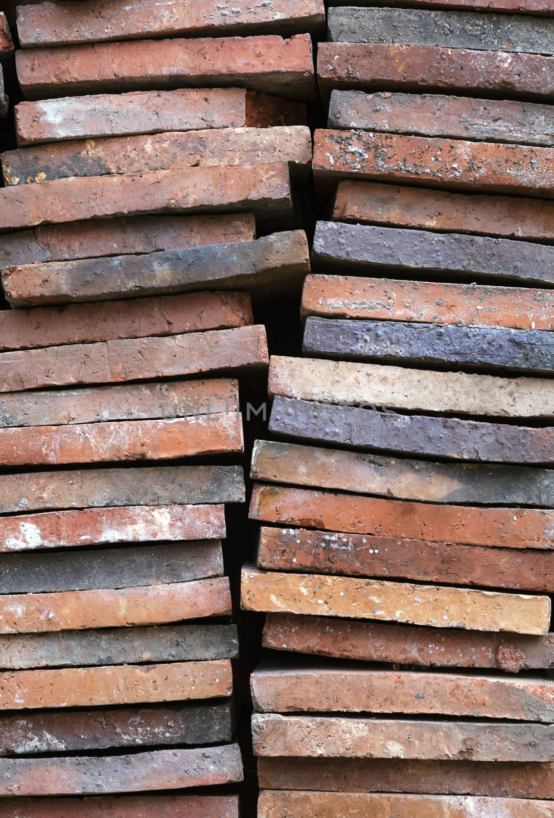 Background of old clay tiles in a pile by Goodday