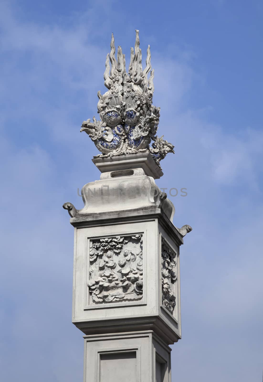 Decorative detail on a ornate column in a Vietnamese temple