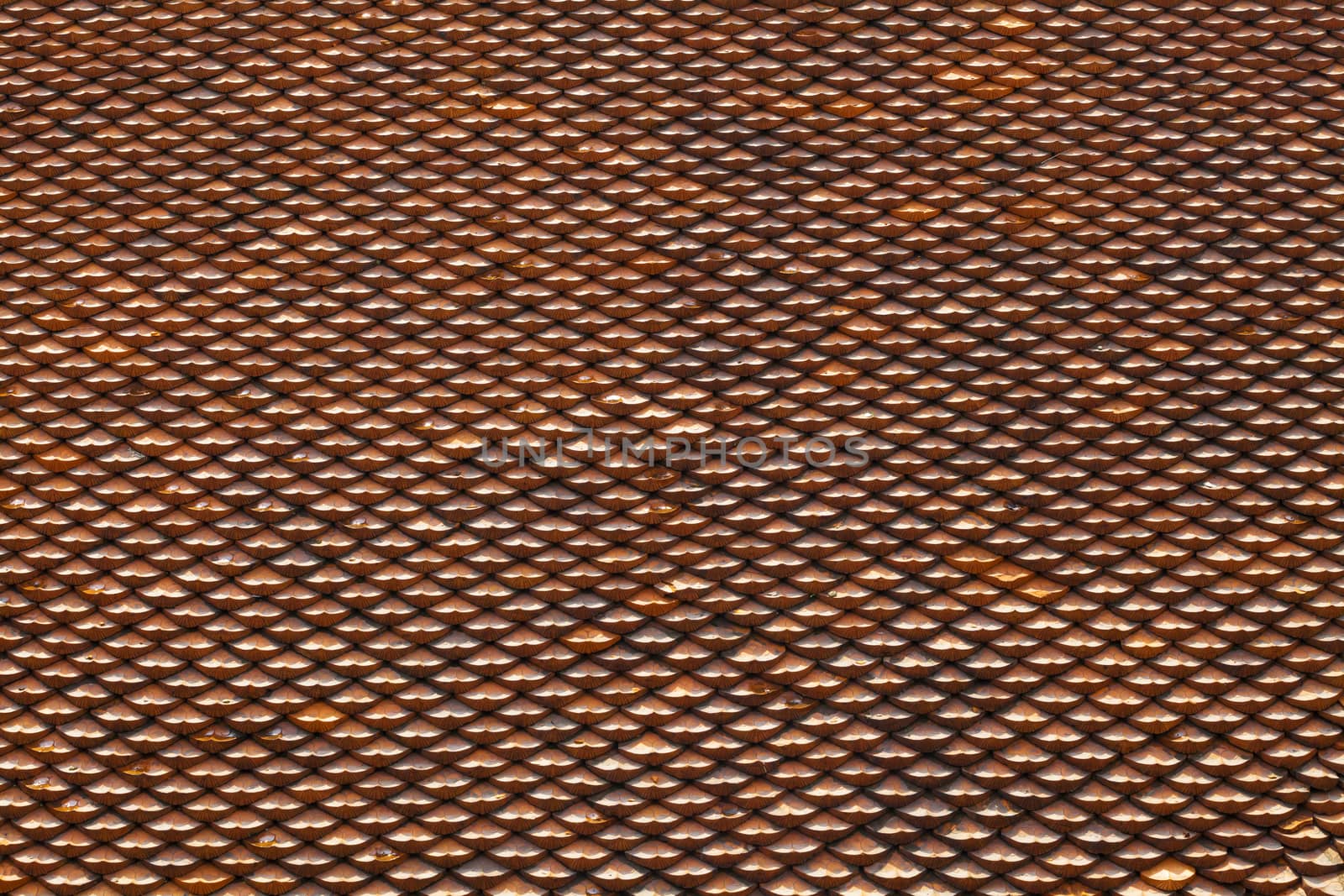 Roof of a house covered with old red tiling