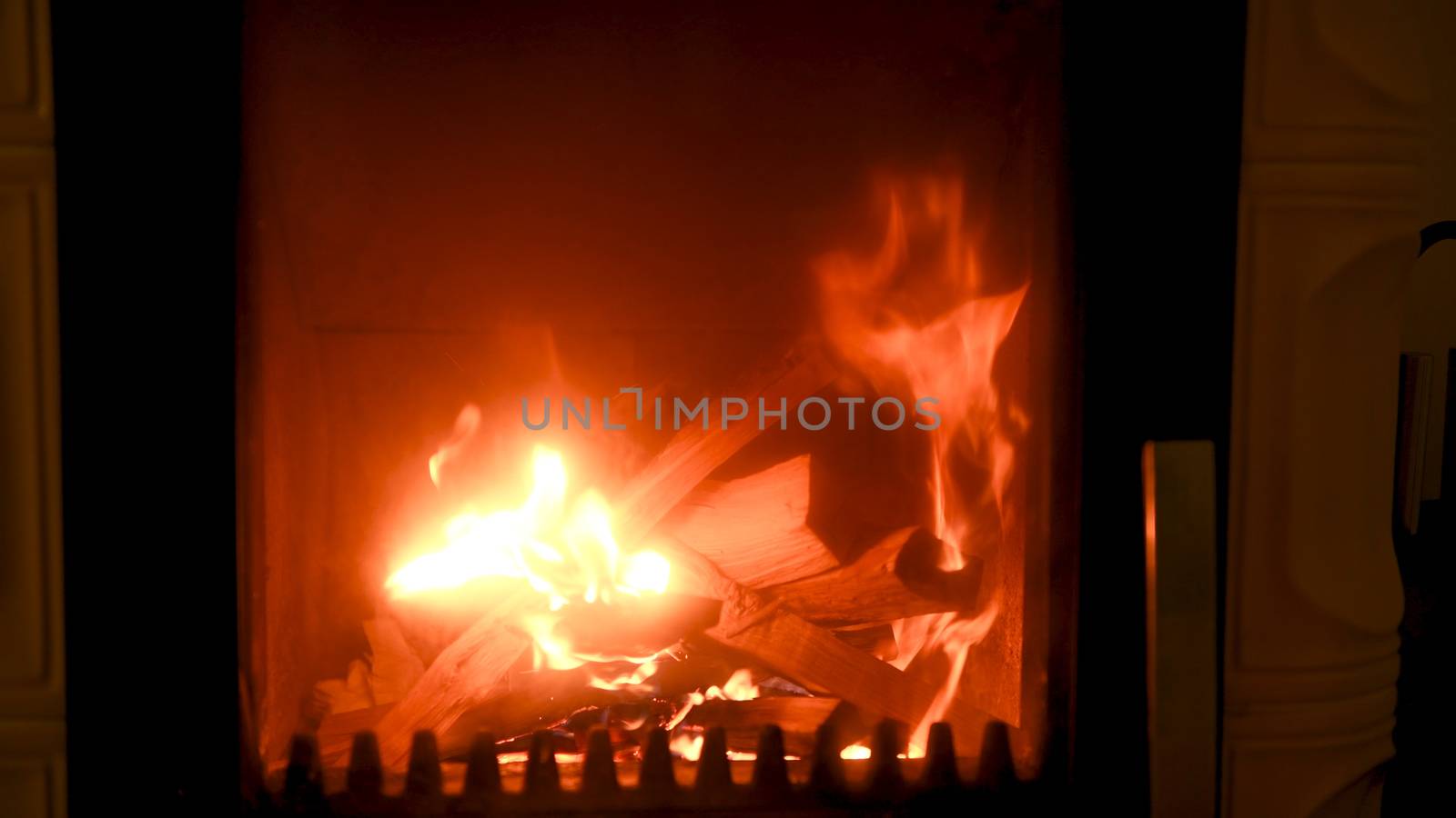 Fire in stove, close up, firewood burning by asafaric